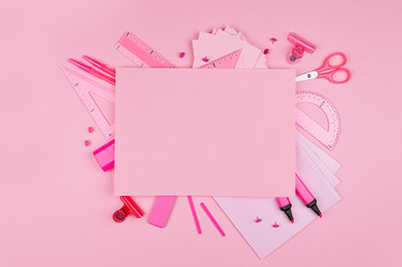 Different office supply and blank paper letterhead for text on pink color background, top view, copy space.