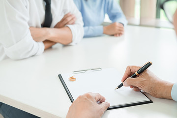 Judge gavel with Justice lawyers deciding, consultation on marriage divorce between married couple and signing divorce documents on table. Concepts of Law and Legal sevices.