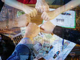 Double exposure Business people of Marketing team as money with a Partnership Team Giving Fist Bump after complete deal.Successful Teamwork Partnership in an Office