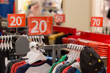 Fototapeta na wymiar Shopping sale. seasonal discount on clothes in apparel shop store