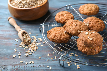 Delicious oatmeal cookies on color table