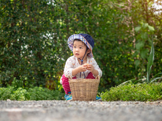 Happy little girl hold the basket in the farm. Farming & Children Concept.