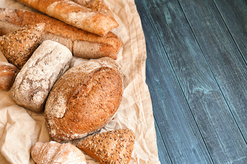 Different bakery products on wooden table