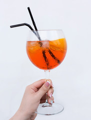 Aperol Spritz cocktail at woman hand