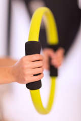 Woman doing pilates ring workout