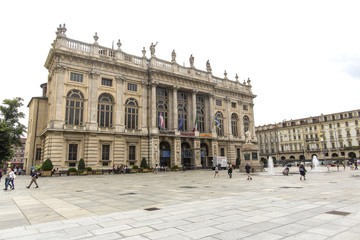 Obraz premium Turin, Italy- June 12, 2018: Piazza Castello, central baroque square in Turin, Italy. Tourists visiting Piazza Castello, the central baroque square