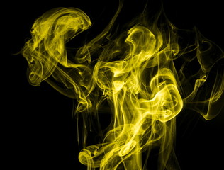 Yellow smoke on black background