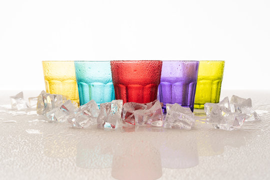 Colorful glass with cold water and ice © ronnachaipark