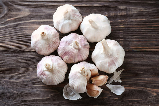 Fresh garlic on wooden background