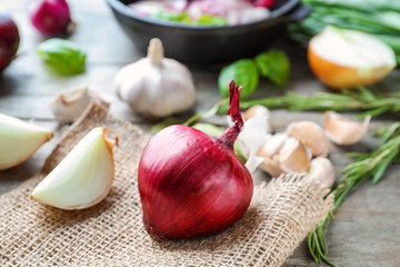 Fresh onion on wooden table
