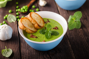 Pea soup, fresh herbs and bacon