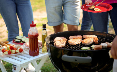 Young people having barbecue party in park