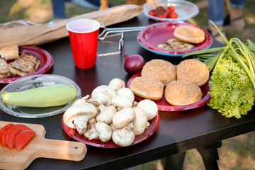 Products for barbecue party on table outdoors