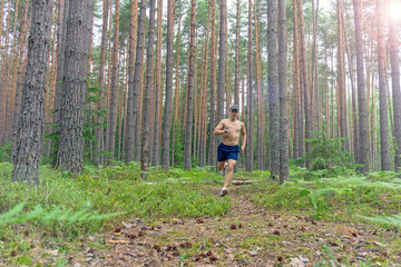 A young man is running along a flattering path