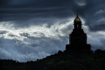 storm gray clouds and old gloomy Russian church