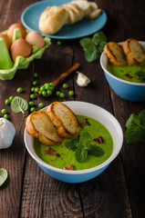 Pea soup, fresh herbs and bacon