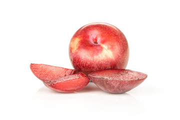Group of one whole three slices of fresh pluot interspecific plums variety isolated on white