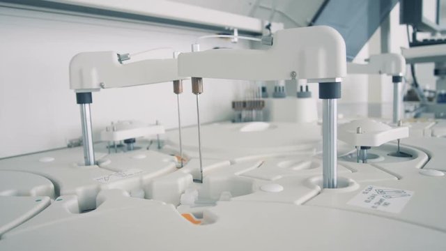 Close up of clinical chemistry analyzer inspecting samples