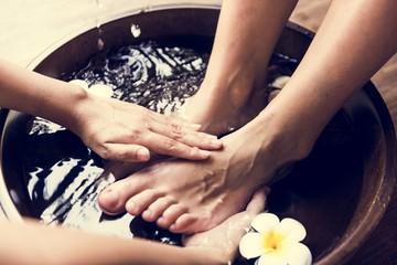 Closeup of feet cleaning at spa - obrazy, fototapety, plakaty