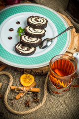 Obraz na płótnie Canvas Chocolate roll with coconut filling.