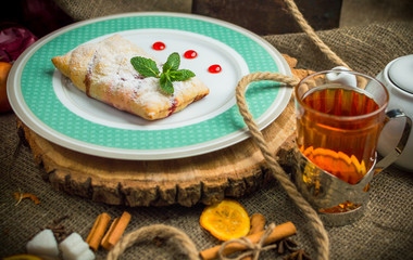 Apple pie with berry sauce.
