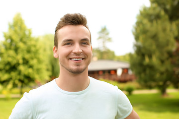 Portrait of handsome young man outdoors