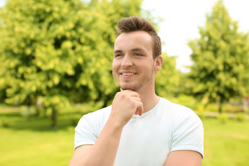 Portrait of handsome young man outdoors