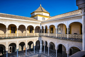 Fototapeta premium Seville, Patio Principal of La Casa De Pilatos. The building is a precious palace in mudejar spanish style. Spain
