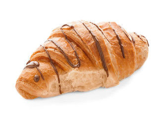 Tasty croissant with chocolate sauce on white background