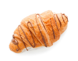Tasty croissant with chocolate sauce on white background