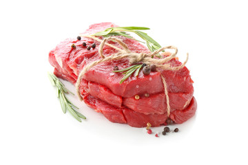 Raw meat with spices on white background