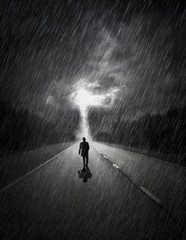 Man walking towards storm