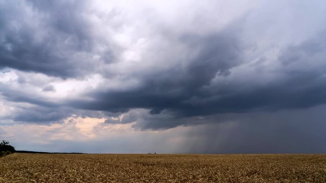Time lapse footage of approaching storm with heavy clouds on blue sky background.