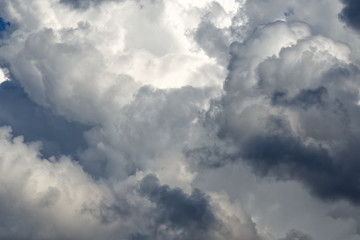 Naklejka na ściany i meble Storm cumulus clouds, gray sky in rain, bad weather background, autumn season.