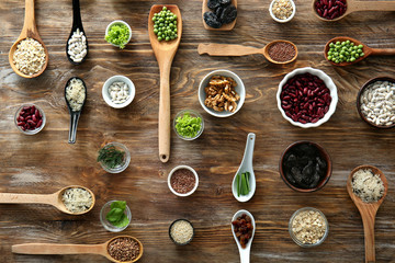 Composition with various healthy products on wooden background