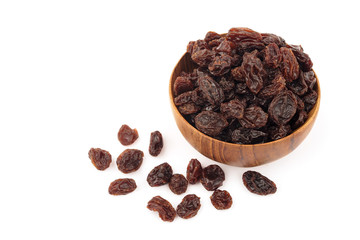 Organic dried Raisins in wooden bowls on white background, Currant