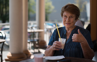 senior drinking in the coffee