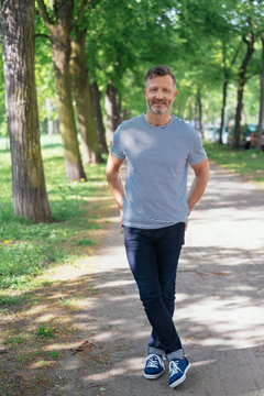 Attractive relaxed middle-aged man in a park