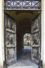 old door that opens onto the courtyard of an ancient palace