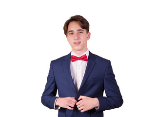 Portrait of elegant young man in suit and bow tie, isolated on white background