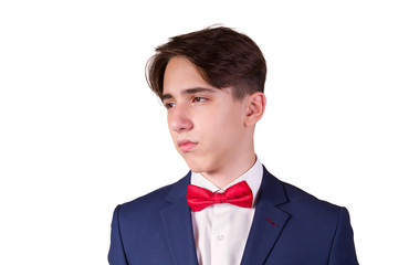 Portrait of elegant young man in suit and bow tie, isolated on white background
