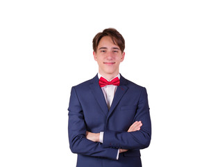 Portrait of elegant young man in suit and bow tie, isolated on white background