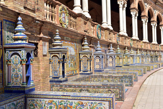 Decorative painted ceramic tiles in alcoves in Plaza de Espana, Seville, Andalusia, Spain