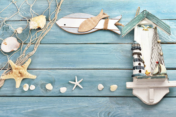 blue wooden background with summer souvenirs