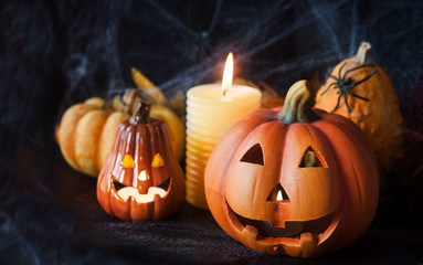 Halloween pumpkin decor with candle and spiders