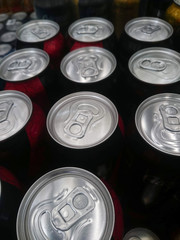 Many beer cans in the supermarket.