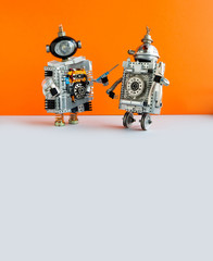Robot electrician and two wheels serviceman robotic character ready for maintenance. Orange wall...