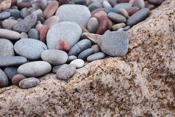 Stones on natural granite background