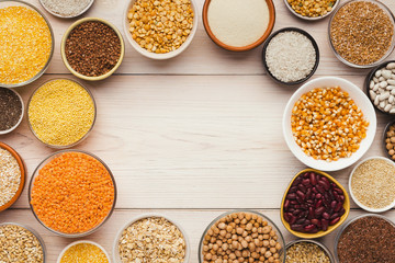 Cereals and legumes assortment on wooden table