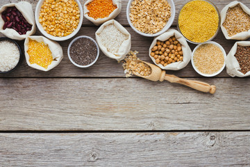 Cereals and legumes assortment on wooden table